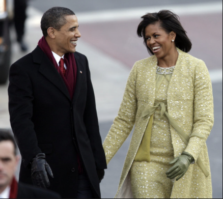 Barack and Michelle Obama walk down Pennsylvania Avenue on their way to the White House in 2009. The Associated Press