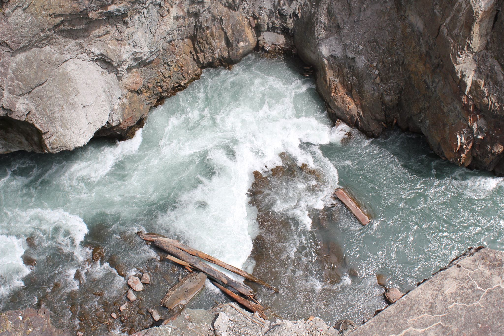 Much of the remaining 30 feet of Glines Canyon Dam was covered in water Monday