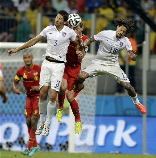 United States' Omar Gonzalez (3) and Jermaine Jones head the ball against Belgium's Jan Vertonghen during the World Cup round of 16 soccer match between Belgium and the USA at the Arena Fonte Nova in Salvador