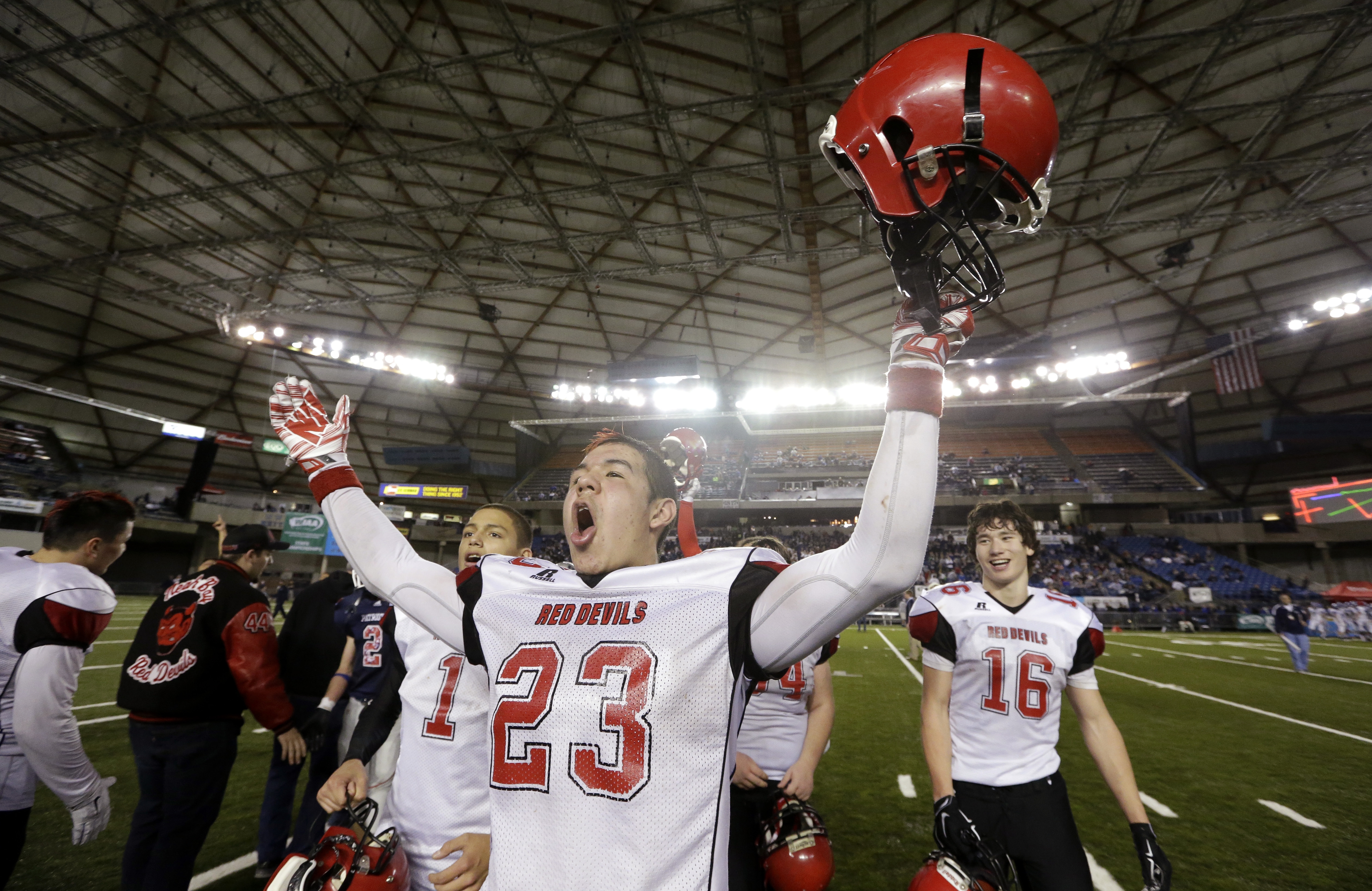 Neah Bay's Chris Martinez lets out a yell after the team beat Liberty Christian 56-38 in the  state class 1B football championship game Saturday in the Tacoma Dome.