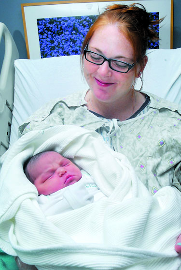 Stevie Martinez-Cruz of Port Angeles holds new daughter