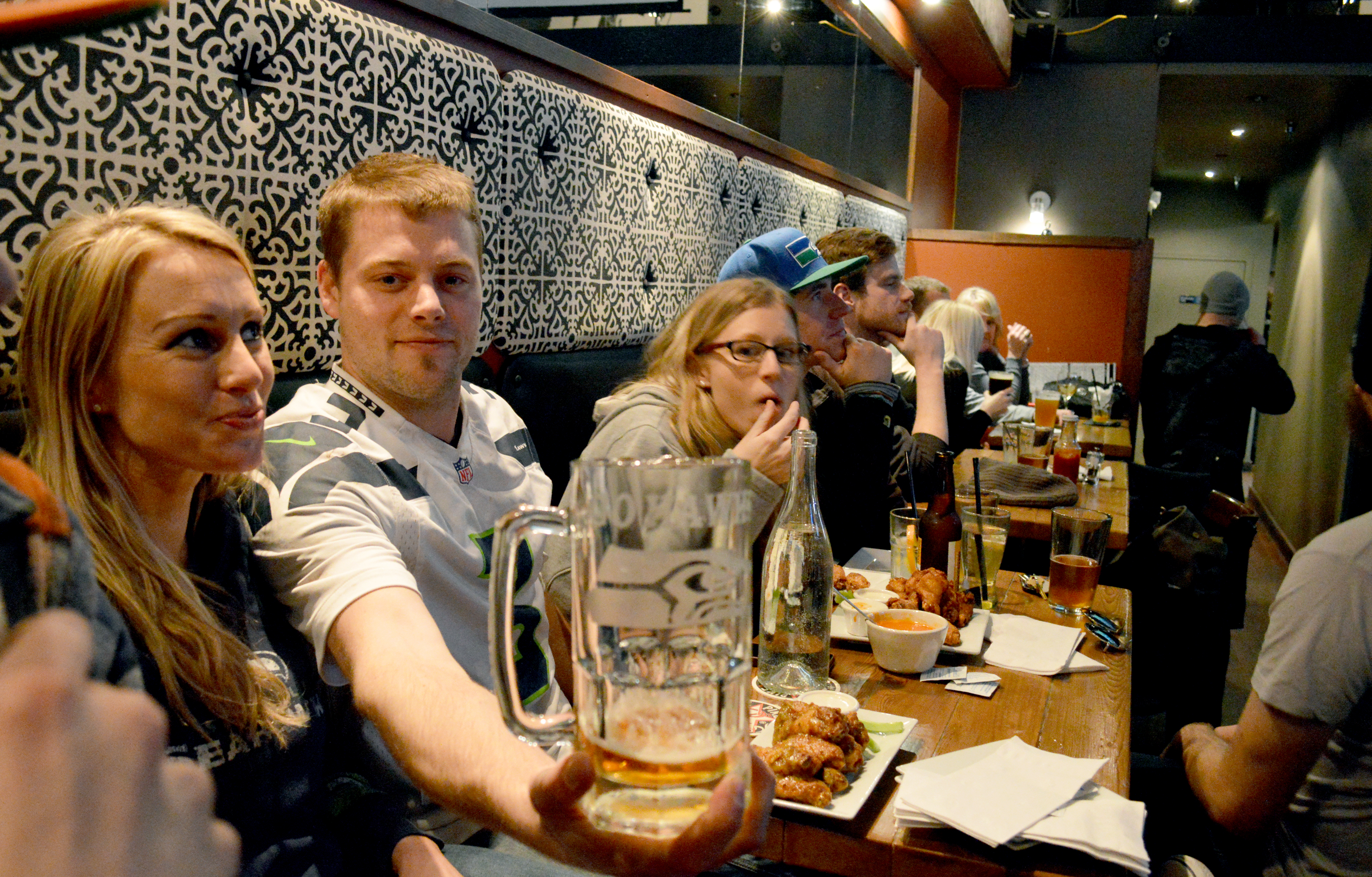 Jake Oppelt shows off his lucky Seahawks mug while watching Sunday's NFC championship game at the Next Door Gastropub in Port Angeles. Joe Smillie/Peninsula Daily News