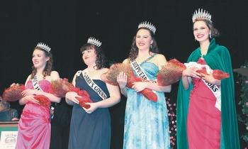 Members of the royal court for the 118th Sequim Irrigation Festival receives applause at the scholarship pageant shortly after they are crowned. From left are Princesses Christie Honroe