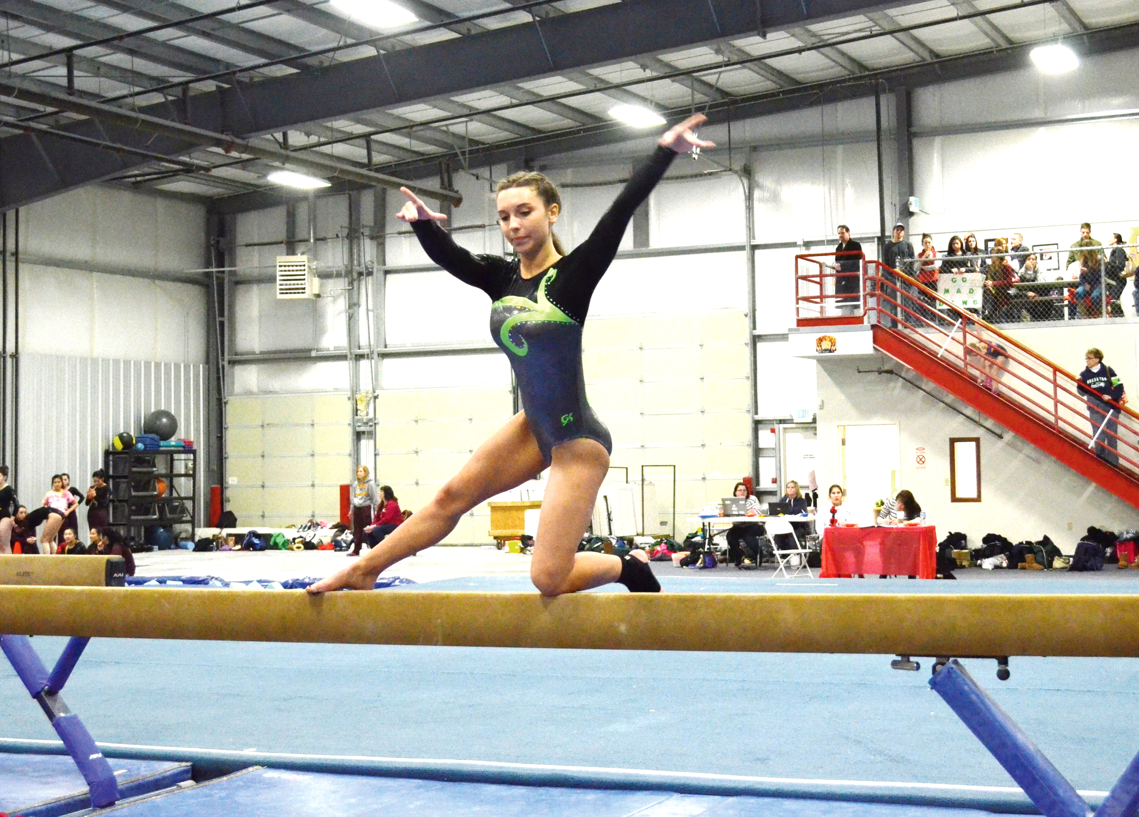 Port Angeles senior Madylan Coventon performs on the balance beam during the Roughriders' win at Black Hills Gymnastics Center in Lacey.