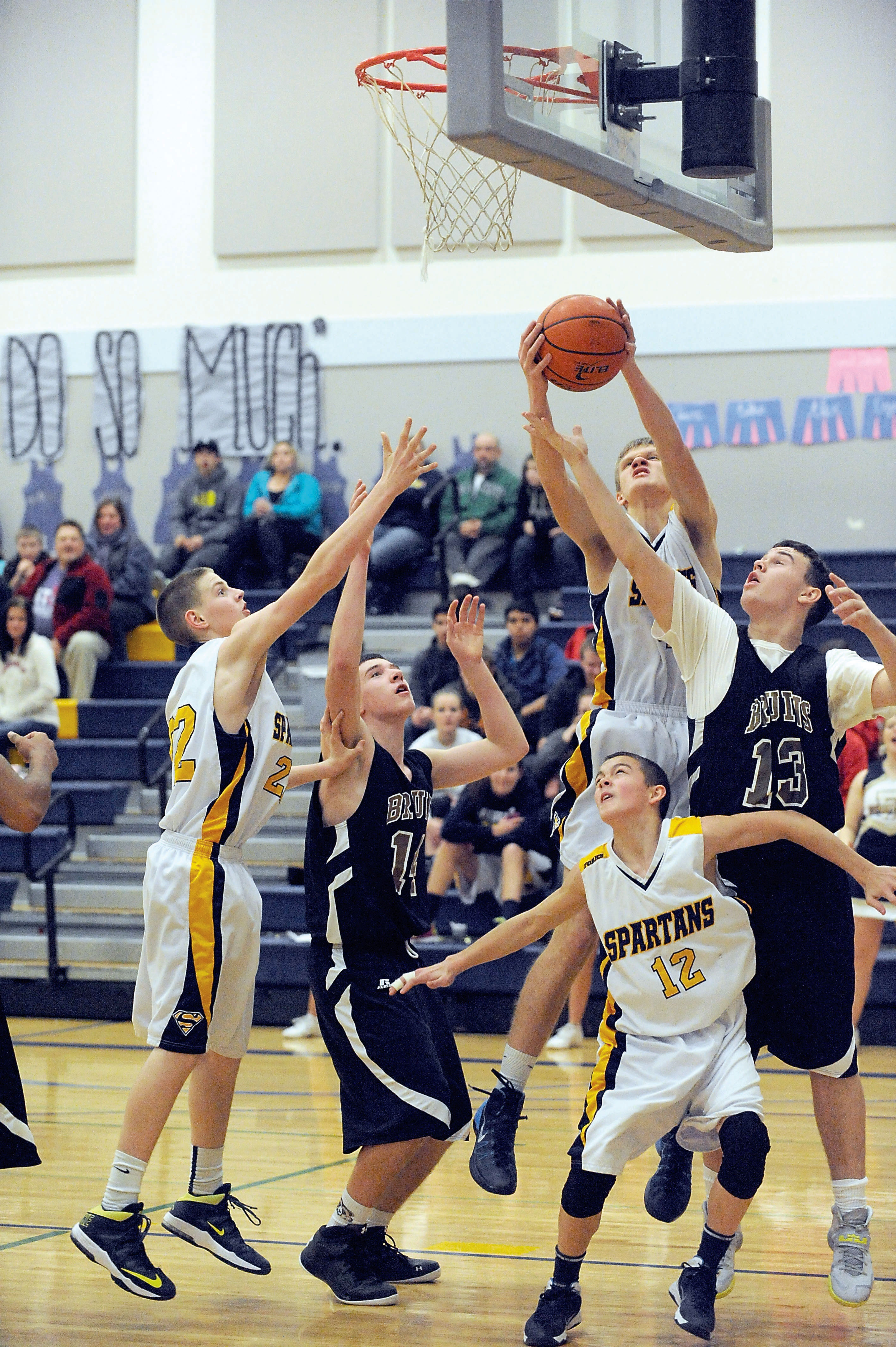 Forks' Austin Pegram pulls a rebound away from Clallam Bay's Kelly Gregory (13). Lonnie Archibald/for Peninsula Daily News