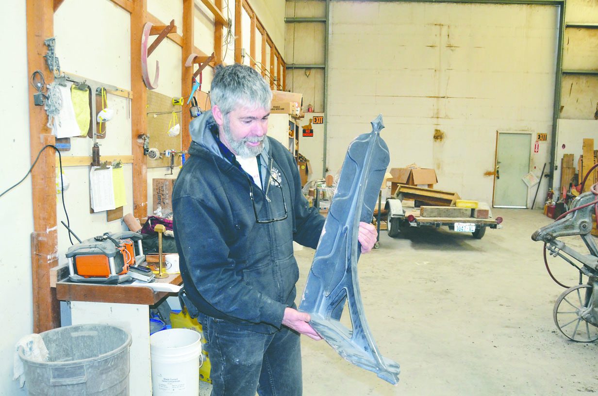 Pete Langley holds a form similar to items stolen from Port Townsend Foundry on Tuesday or early Wednesday. Charlie Bermant/Peninsula Daily News