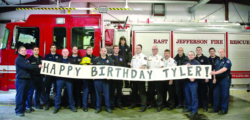 East Jefferson Fire-Rescue firefighters gather to wish 6-year-old Tyler Seddon of Rhode Island a happy birthday.