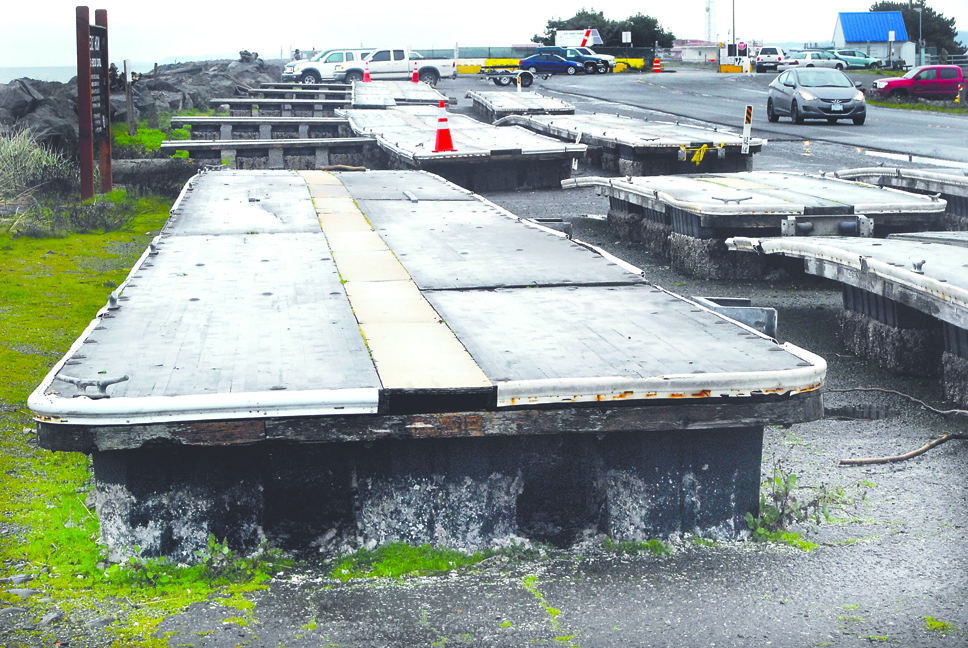 Sections of floating dock that have provided temporary seasonal moorage at Port Angeles City Pier sit in storage at Ediz Hook on Thursday in varying states of age-related decay. Keith Thorpe/Peninsula Daily News