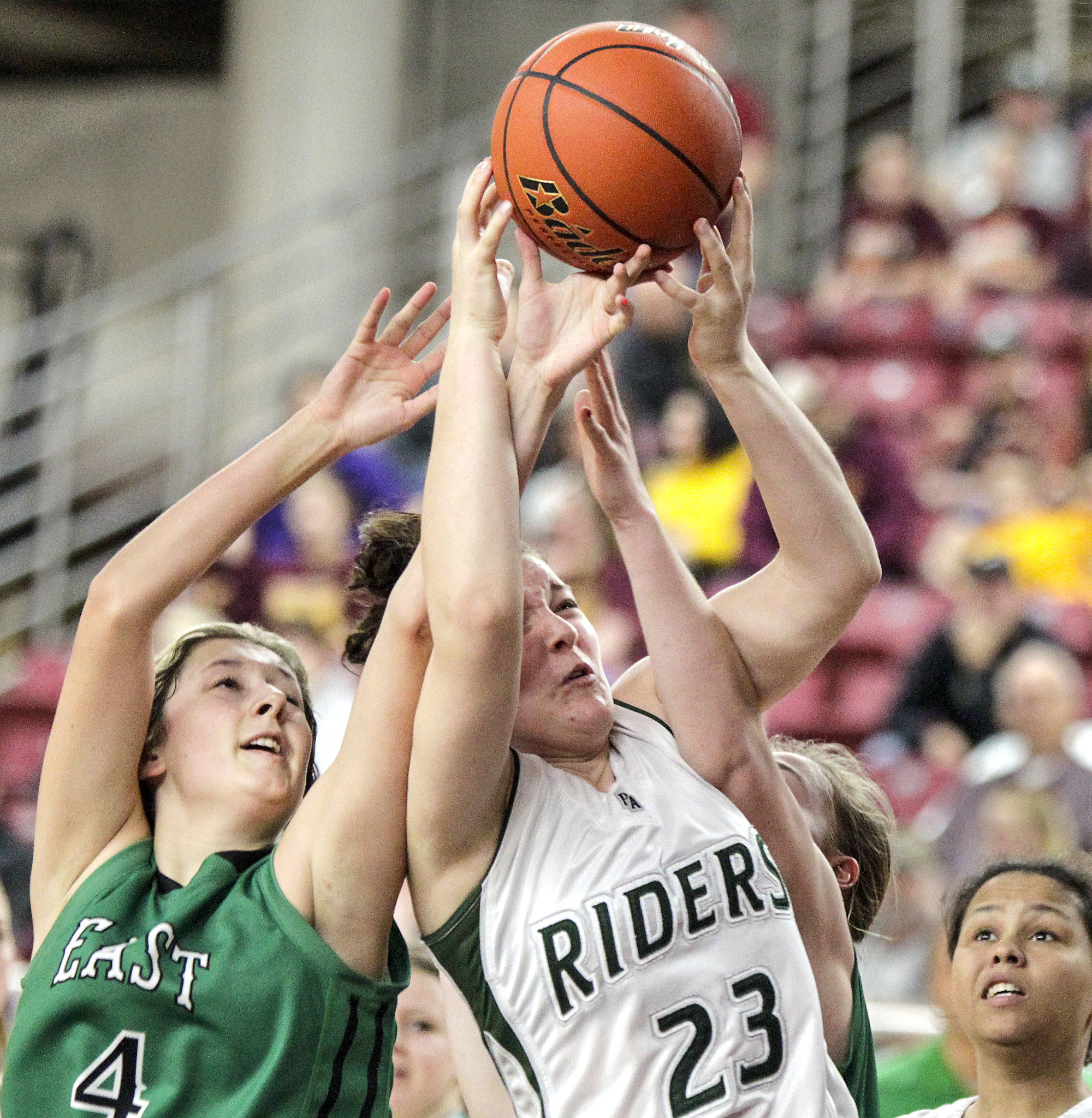 Port Angeles' Bailee Jones fights for a rebound with East Valley's Hannah Burland. Jones' aggressive play at the state tournament was a highlight for the Roughriders. Bill Wagner/The Daily News of Longview.