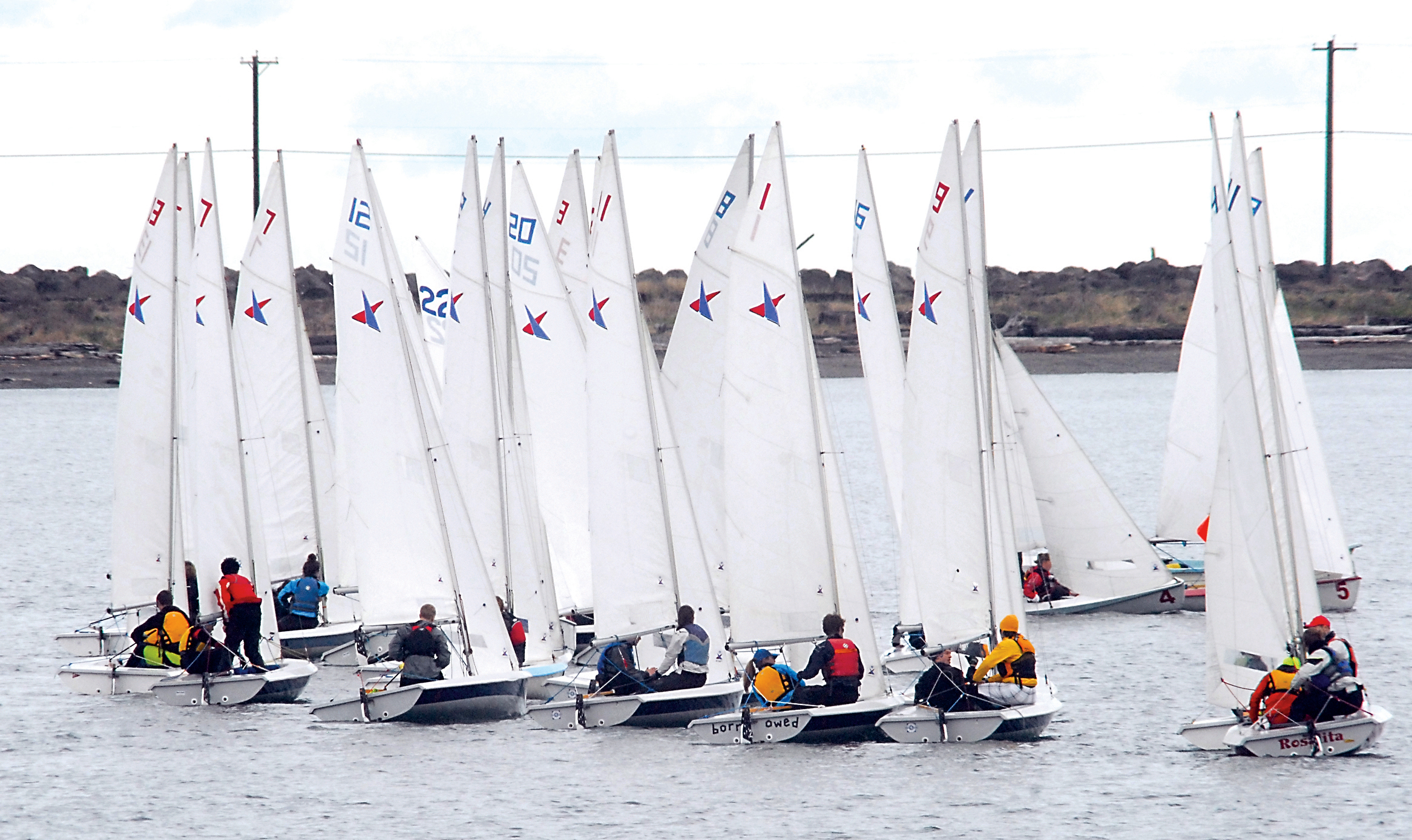 High school teams from across western Washington position themselves for the start of the first-round race of the High School Olympic Cup sailboat regatta on Port Angeles Harbor. Keith Thorpe/Peninsula Daily News