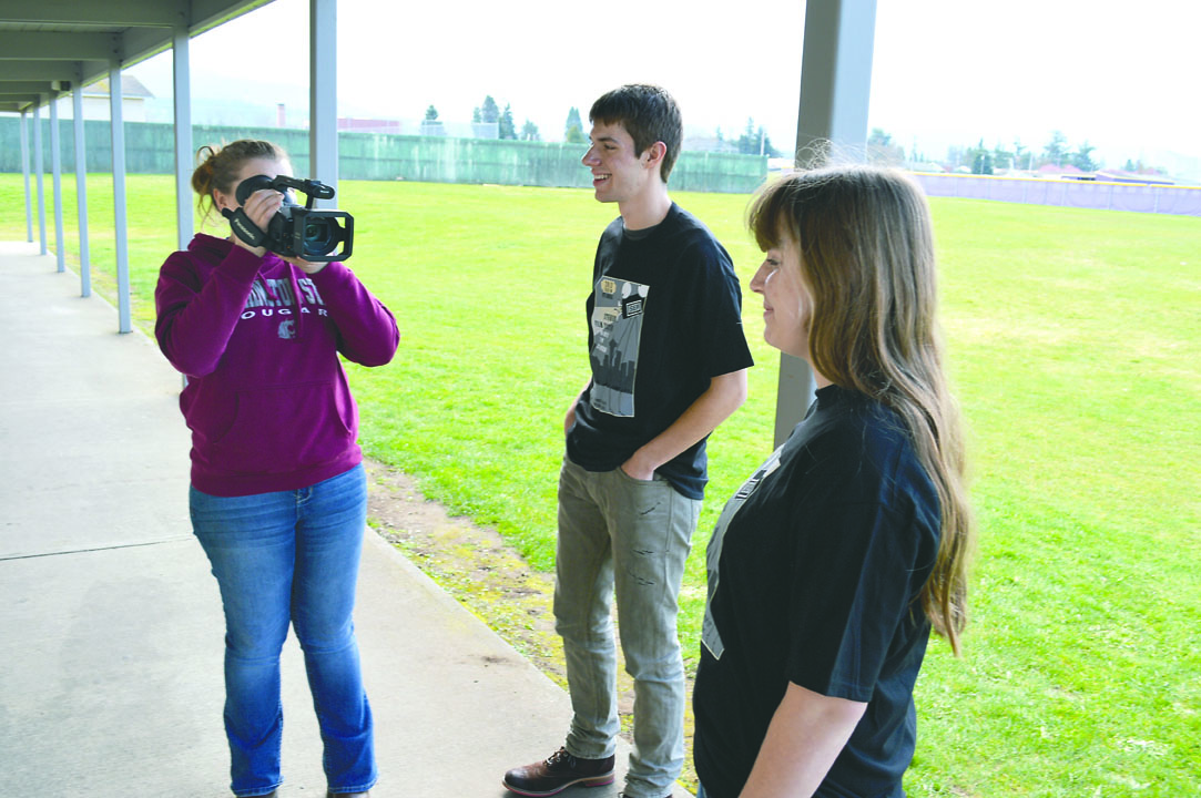 Sequim High School senior Torrie McIntyre films fellow movie-makers Tristan and Tenille Tosland. The trio made a film