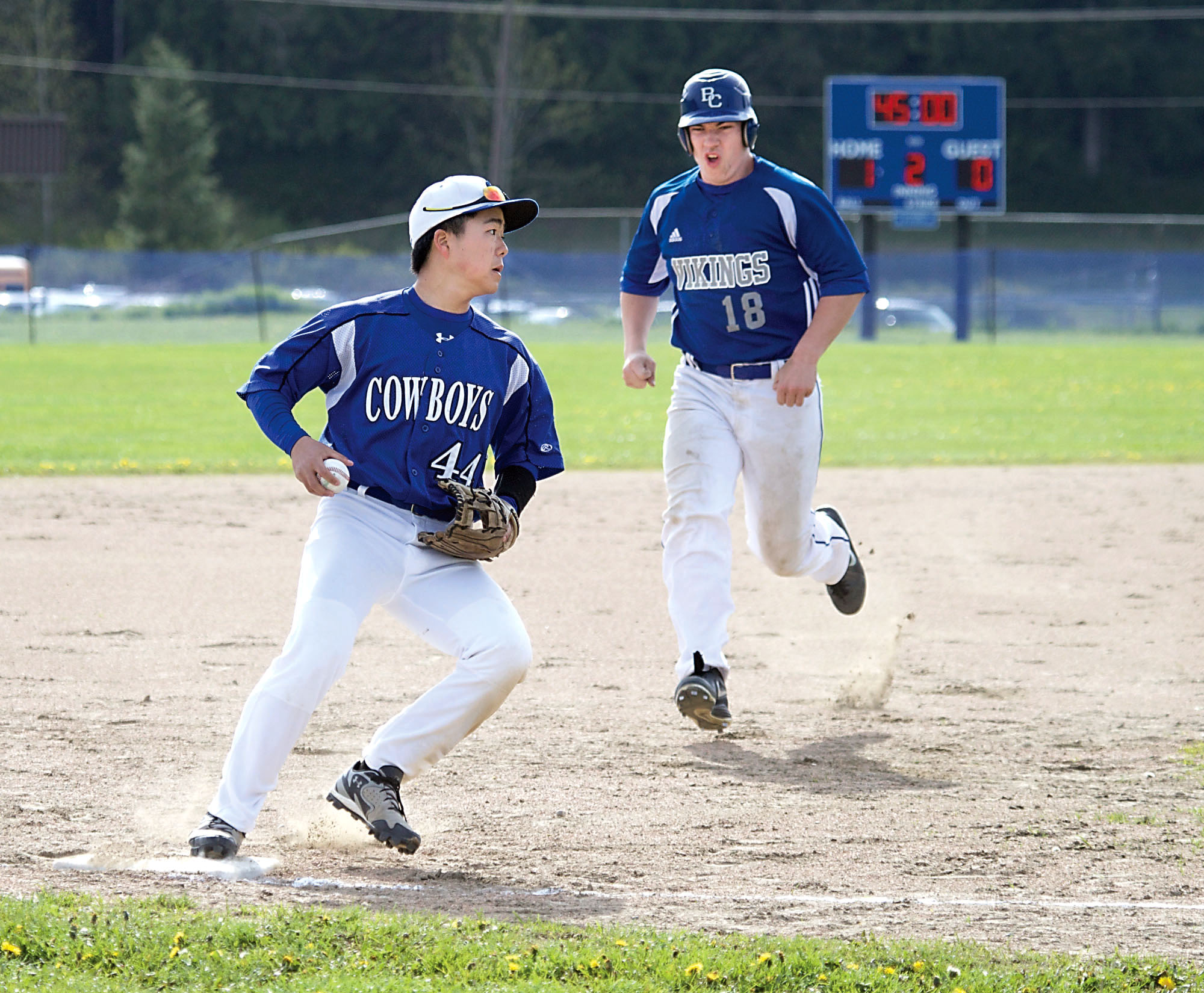 Chimacum's Yoshi Icuchi (44) looks to home plate for another play after making a force out on Bellevue Christian's Glen Boatman. Steve Mullensky/for Peninsula Daily News