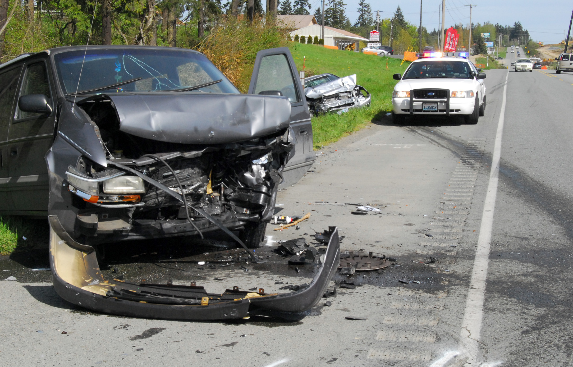 A van involved in a head-on collision with a passenger car