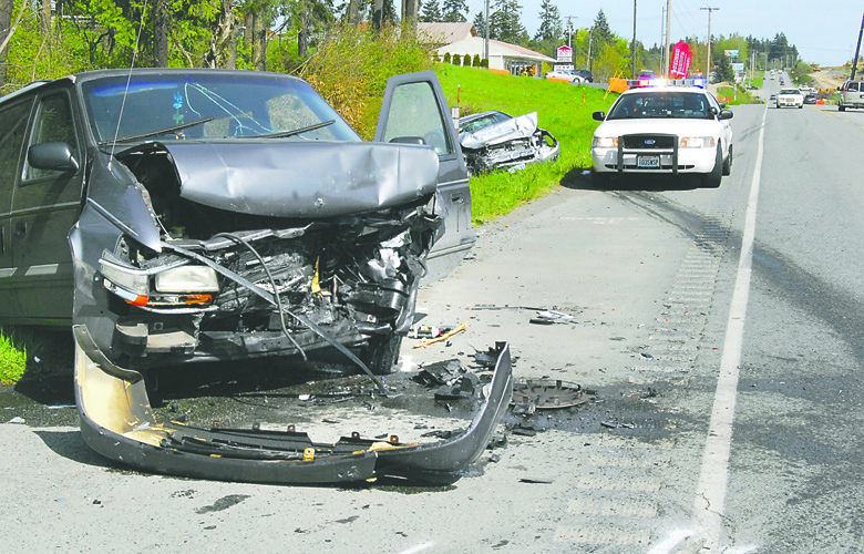 A minivan involved in a head-on collision with a passenger car