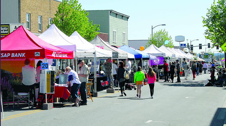 Merchant booths line Washington Street in downtown Sequim during 2013's kickoff weekend of the Sequim Irrigation Festival. Keith Thorpe/Peninsula Daily News