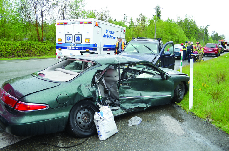 Two cars sit at the intersection of U.S. Highway 101 and Diamond Point Road on Thursday after a collision. Patrick Young/Clallam County Fire District No. 3