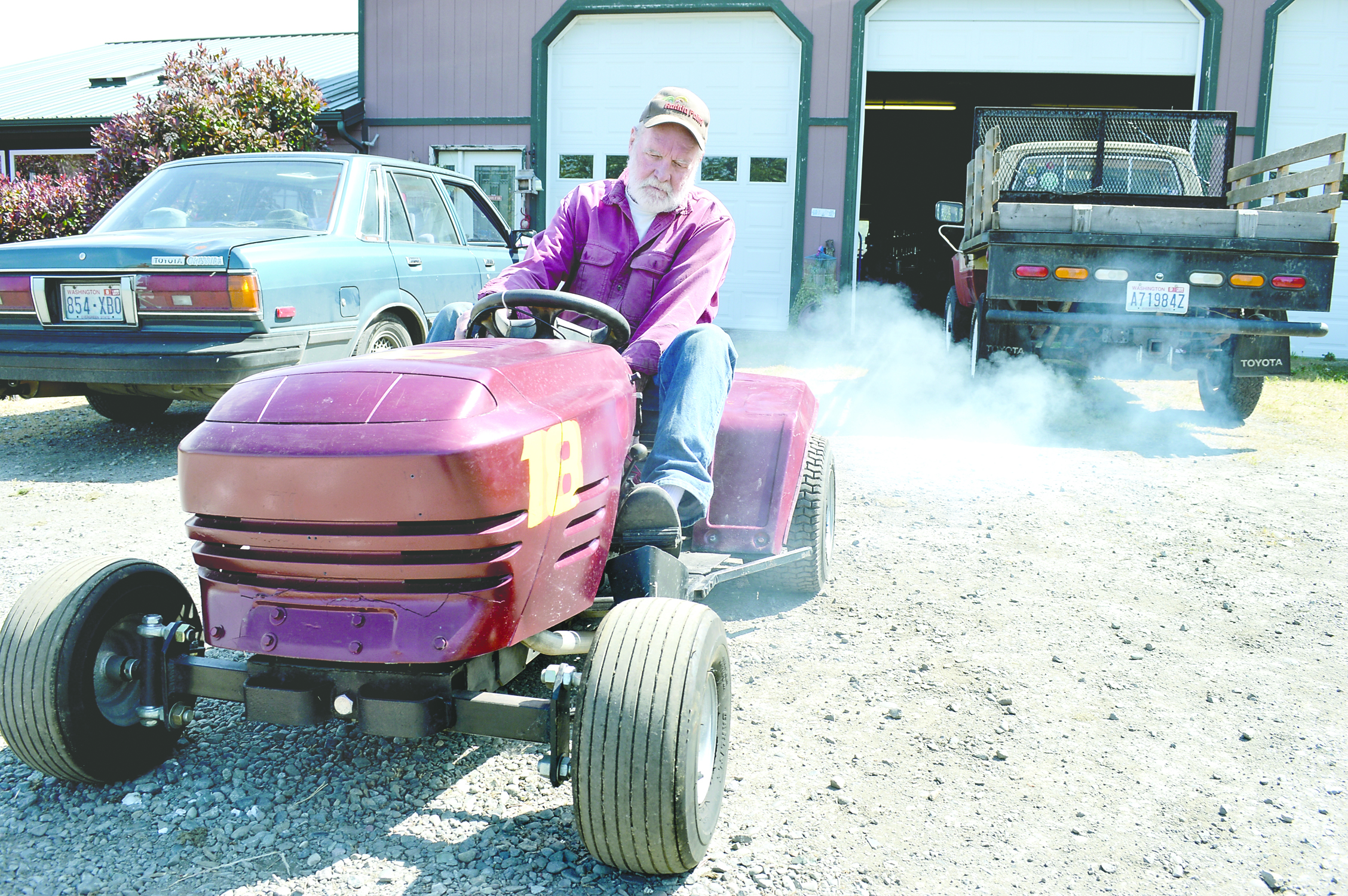 Don Trussell fires up his souped-up lawnmower for the races set for Saturday at the Logging Show