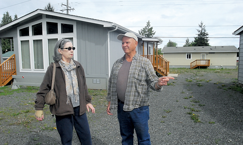 Mary and Dan Davis discuss the modular homes on property they own at Baker Street and Pioneer Road in Gales Addition east of Port Angeles on Friday. A previous home at the site was destroyed during a bulldozer rampage in May 2013. Keith Thorpe/Peninsula Daily News