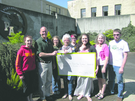 Port Angeles High School's choir and NJROTC unit present checks totaling $3