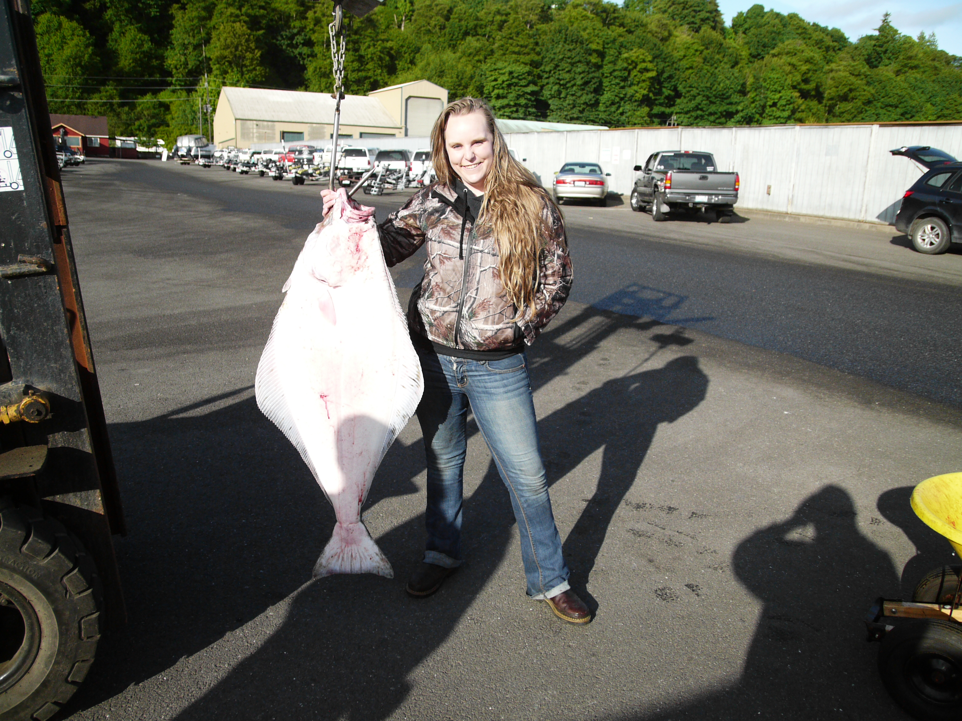 Sequim's Randi Owens landed this 61-pound halibut in Freshwater Bay and leads the Port Angeles Salmon Club's halibut derby entering today's final day of fishing. Burt Blatter/Port Angeles Salmon Club