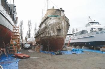 The Western Flyer is shown in the Port Townsend Boat Haven between two other vessels. Charlie Bermant/Peninsula Daily News