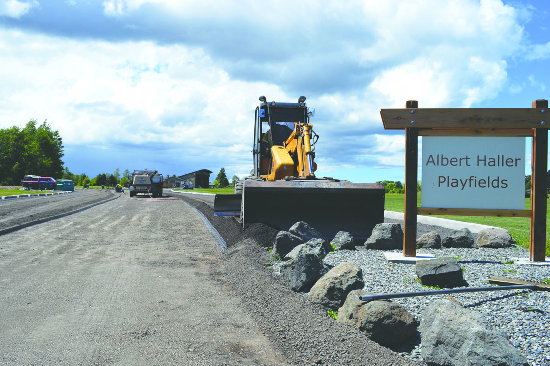 An earthmover prepares the parking lot at the Albert Haller Playfields for its pervious pavement. Joe Smillie/Peninsula Daily News