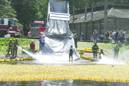 The rubber ducks are coming right at you as Port Angeles firefighters give them a little burst from behind to keep the mass of 26