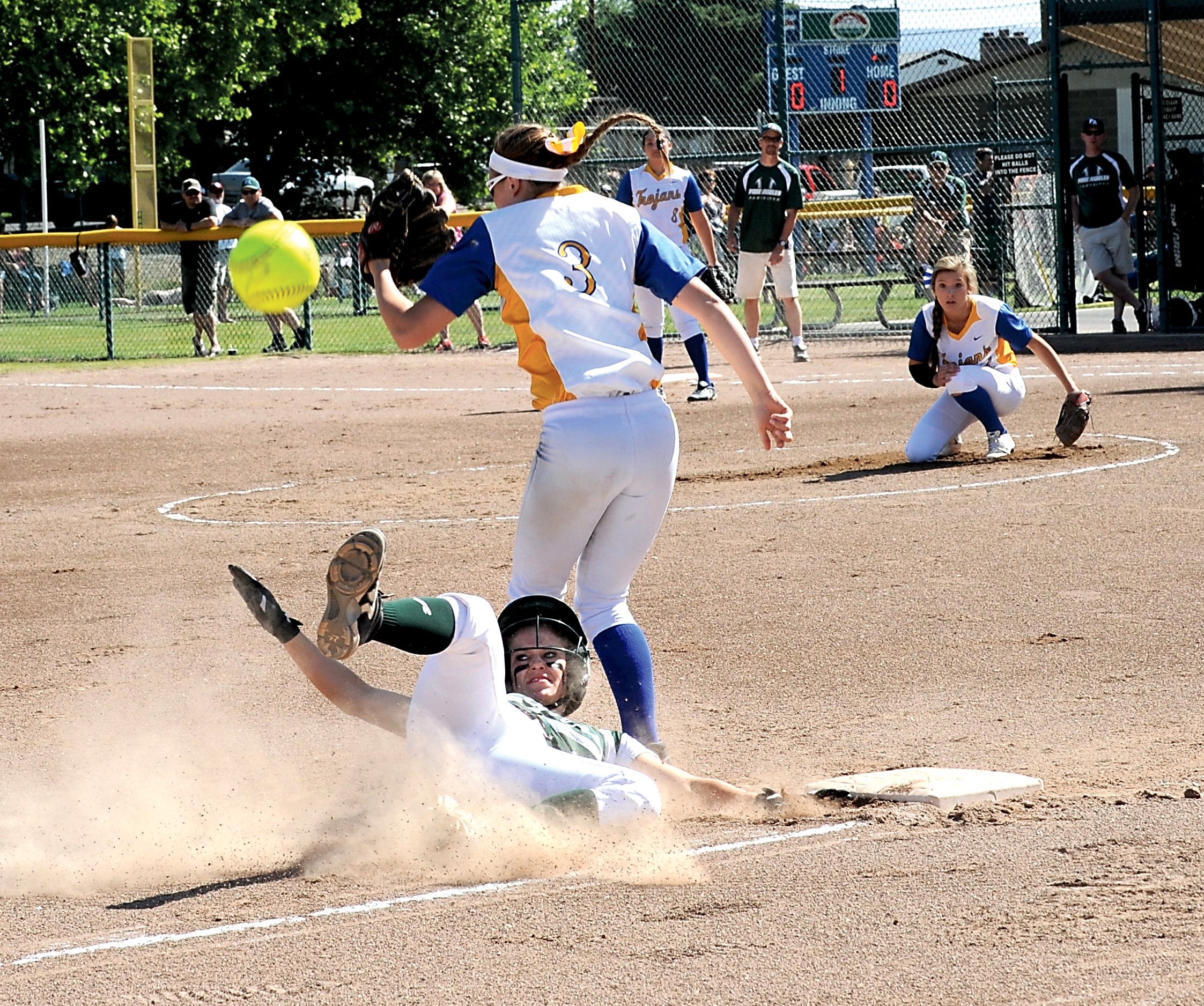 Port Angeles' Haley Gray slides safely into third after the ball gets by Fife's Angela Leingang during the state tournament at Carlon Park in Selah. Lonnie Archibald/for Peninsula Daily News