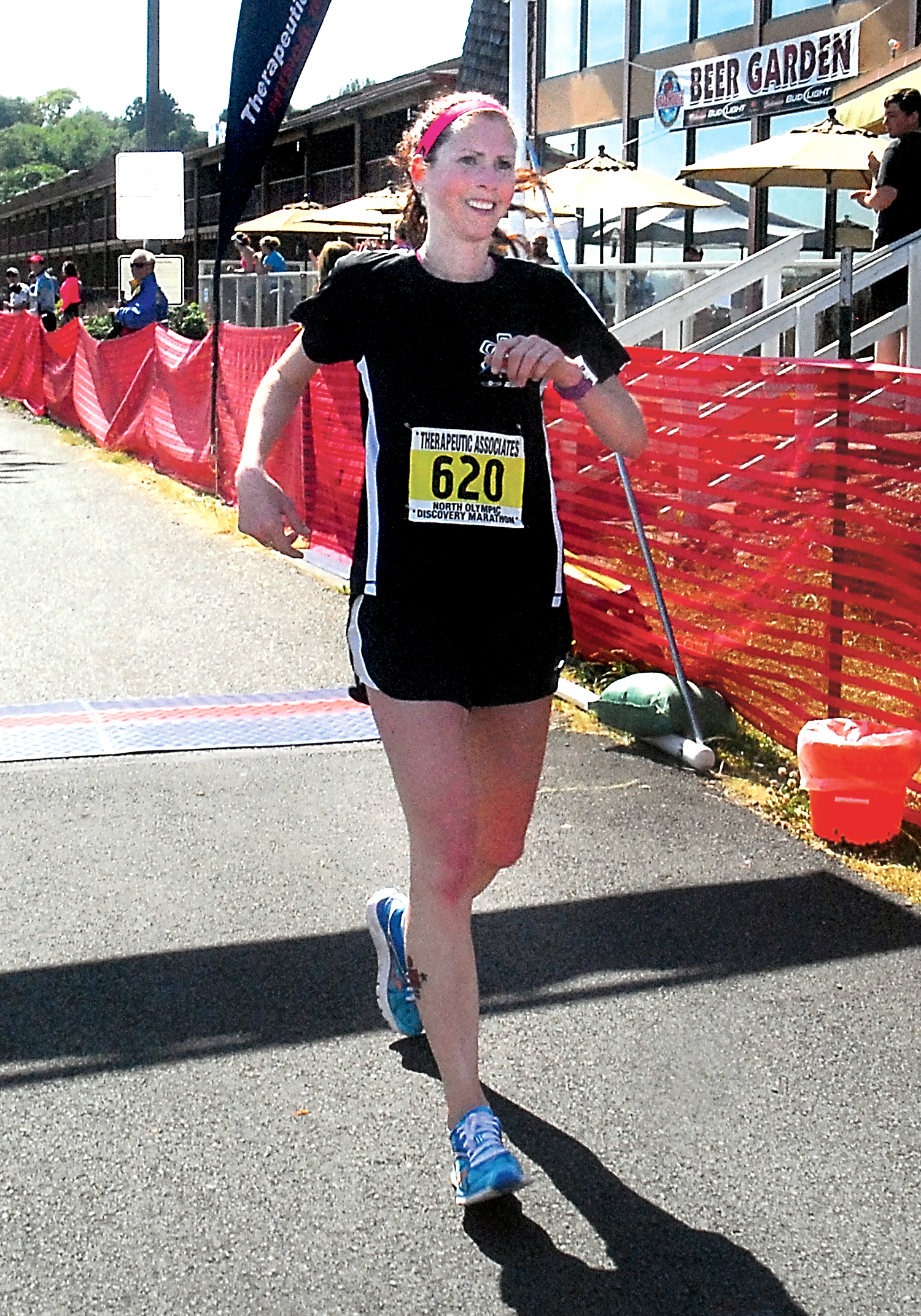 Sarah Getty of Des Moines crosses the finish line at Port Angeles City Pier