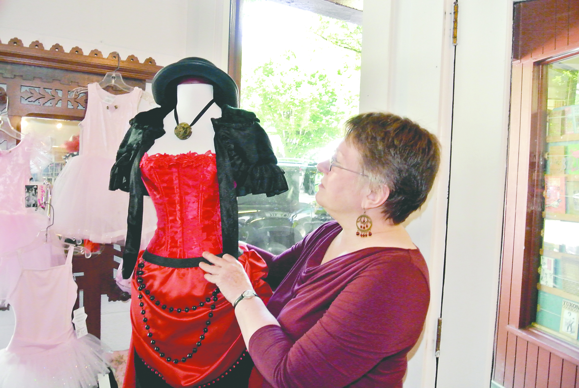 Body Shop proprietor Cheri Raab arranges steampunk gear in her store in Port Townsend. Charlie Bermant/Peninsula Daily News