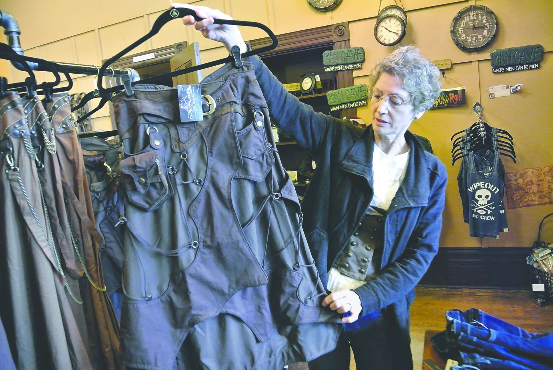 World's End owner Joyce Janetski shows off a Steampunk dress carried in her store. Charlie Bermant/Peninsula Daily News