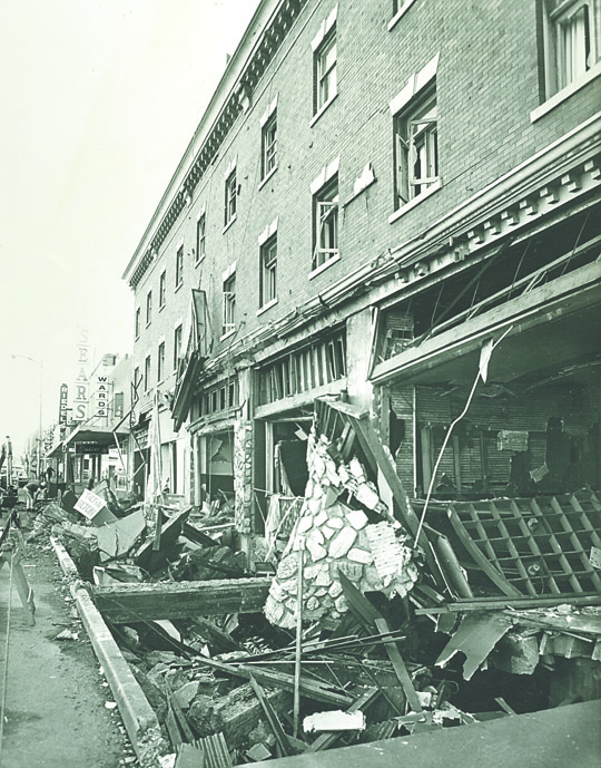 The destroyed sidewalk and restaurant along Front Street after the 1971 gas line explosion