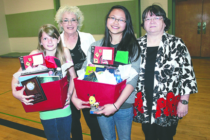 From left are Hamilton Elementary School sixth-grader Mary Shore