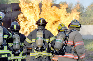 Clallam County Fire District No. 2 firefighters battle a propane fire during a recent training exercise. Clallam County Fire District No. 2