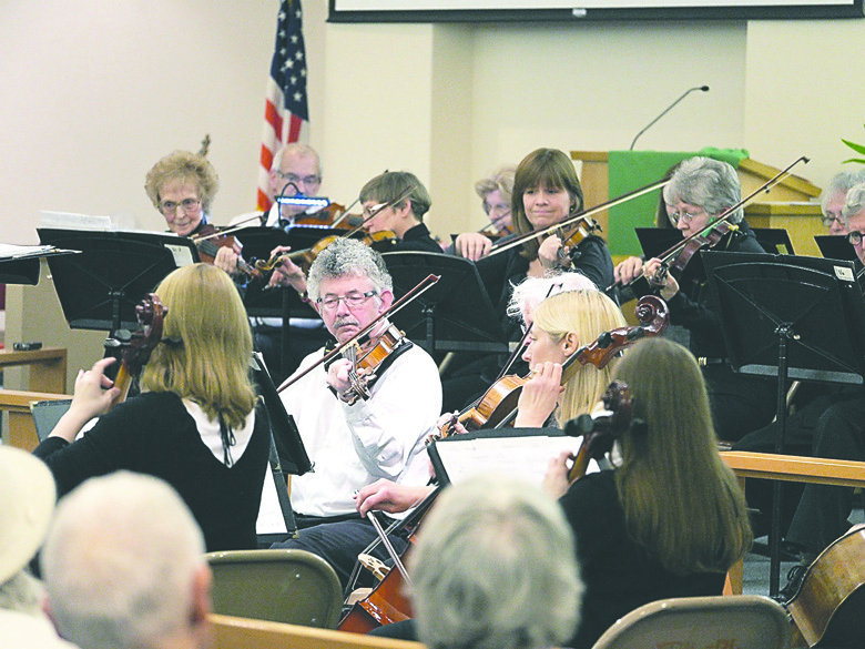 The Sequim Community Orchestra's strings section plays during a February concert. The group wraps its current season with a concert tonight. Alan Halfhill