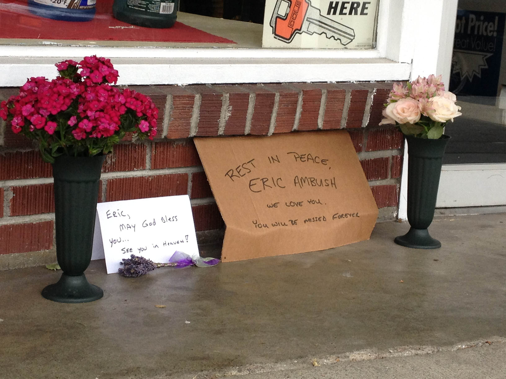 Signs and flowers adorn the sidewalk outside A-1 Auto Parts in Sequim