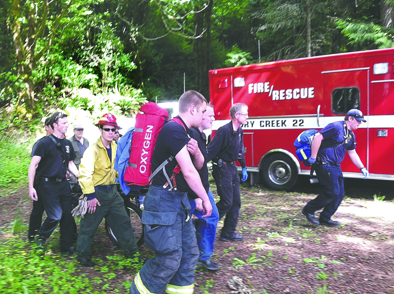 Clallam County Firefighter/Medics and Olympic National Park crews extricate hiker form Elwha River trail.