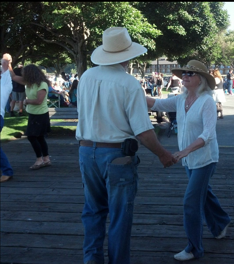 Ann and Steve Johnson dance to the tunes of Haywire at last week's Concert on the Pier in Port Angeles. Peninsula Daily News