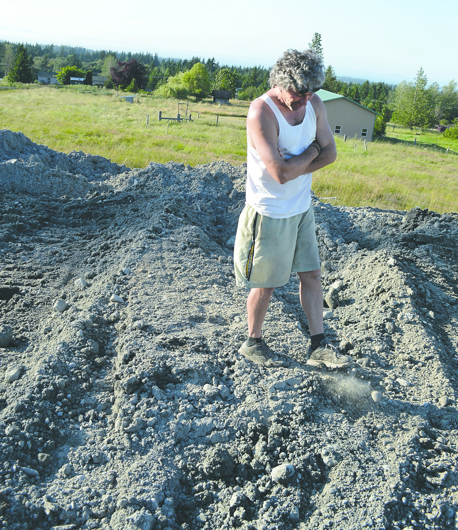 Ed Telenick of Sequim stands on what he refers to as "Mount Sherburne