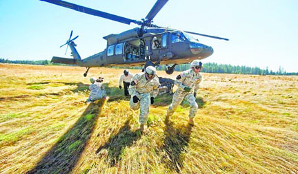 A “sling load” exercise with a Black Hawk takes place July 26 at Joint Base Lewis-McChord. Tacoma News Tribune via McClatchy News Service