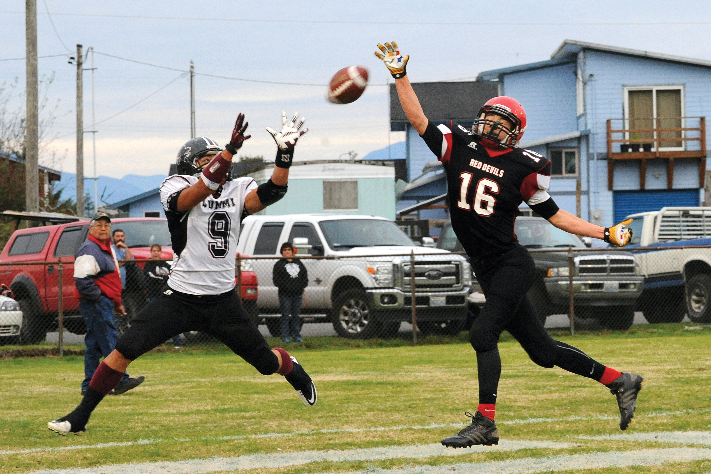 Neah Bay's Cole Svec (16) attempts to knock down a pass against Lummi's Devin Cooper (9) last season. Svec