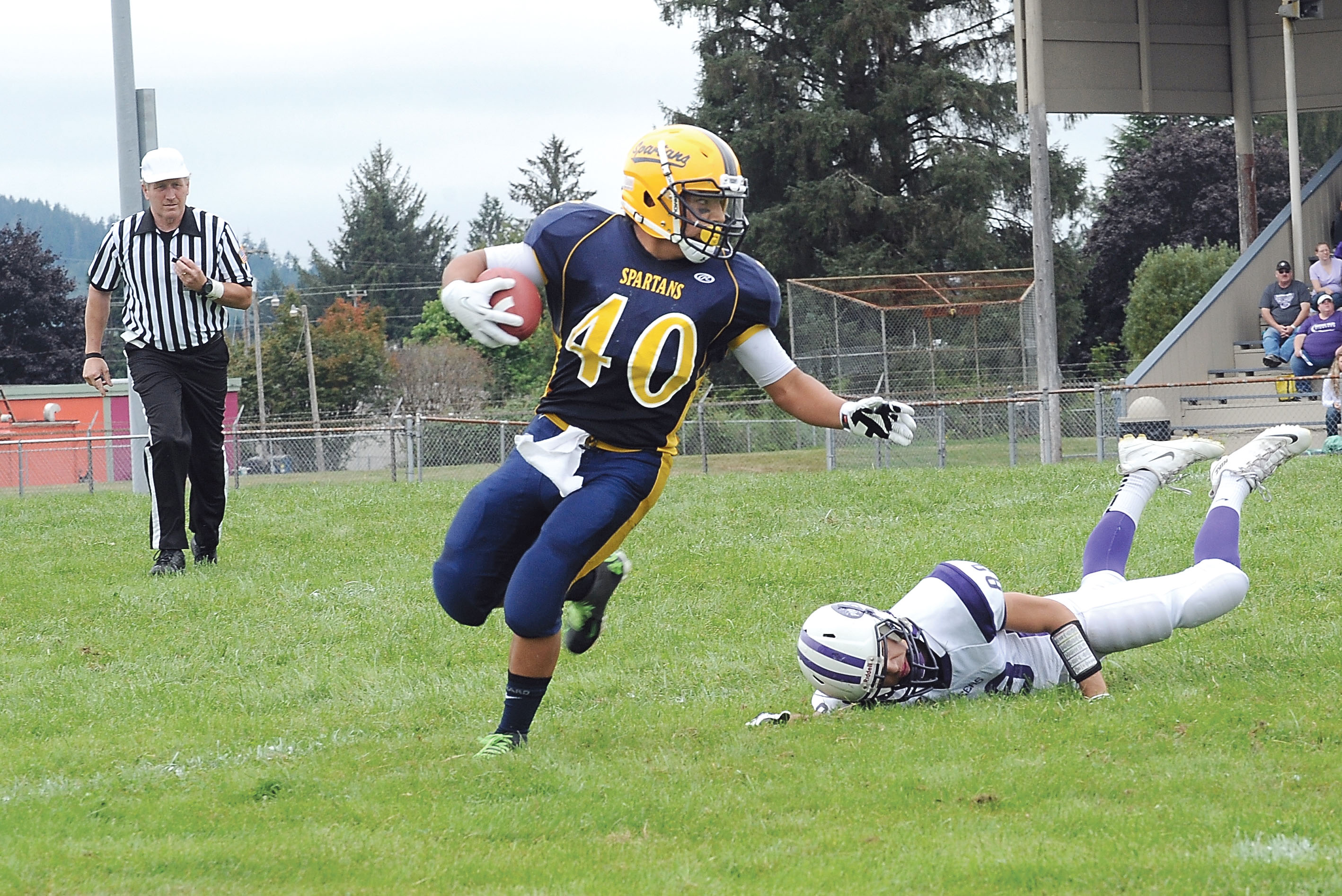 Forks running back Dmitri Sampson (40) carries the ball against Nooksack Valley last season. Sampson