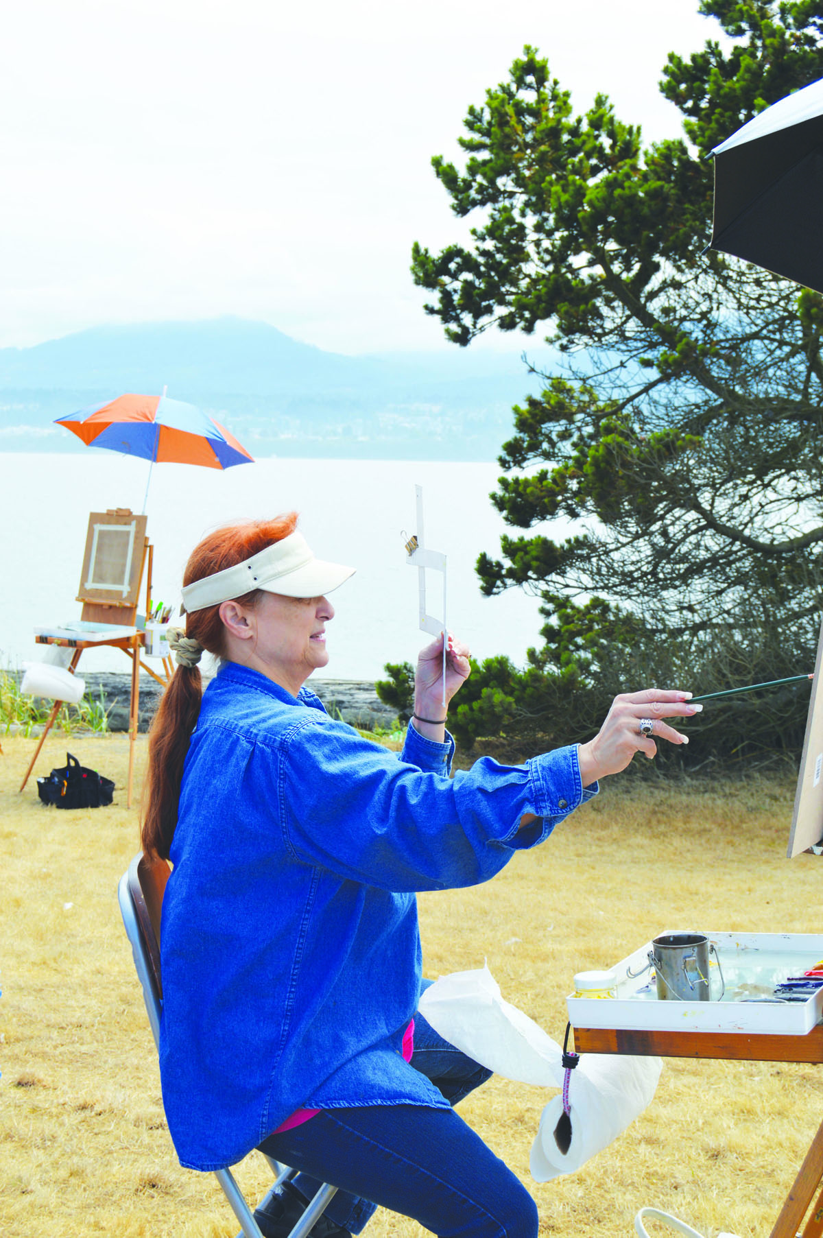 Teaching artist Susan Martin Spar paints plein air — out in the fresh air — on Ediz Hook on a recent Saturday. Spar teaches a class through the Port Angeles Fine Arts Center