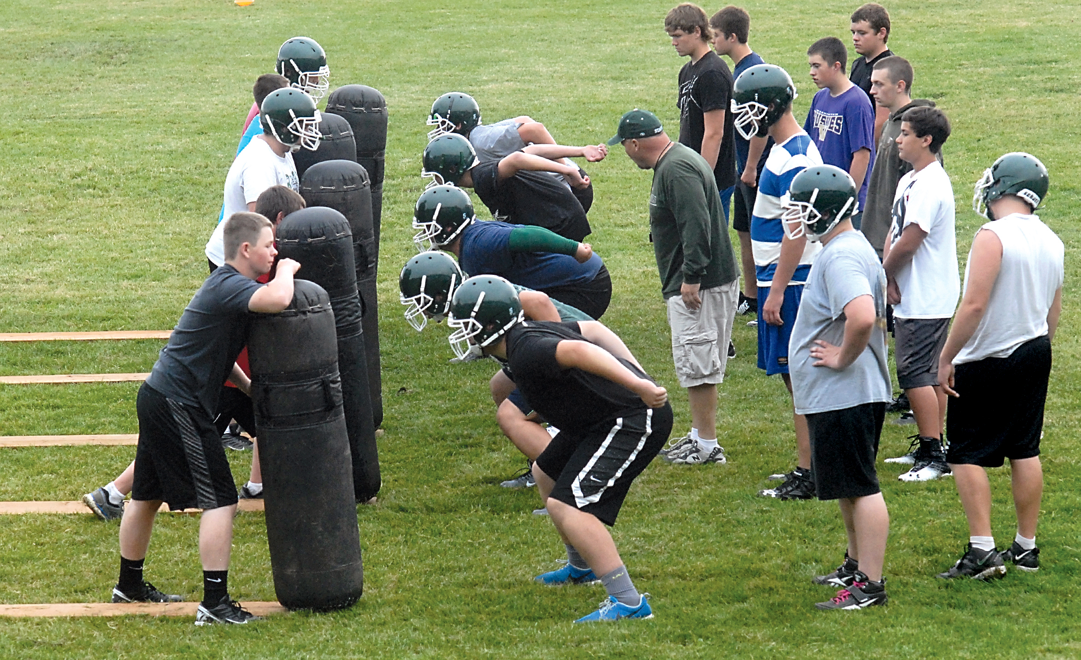 Members of the Port Angeles High School football team take part in line drills Wednesday at the school's practice field. Football practices opened throughout the state Wednesday. Keith Thorpe/Peninsula Daily News