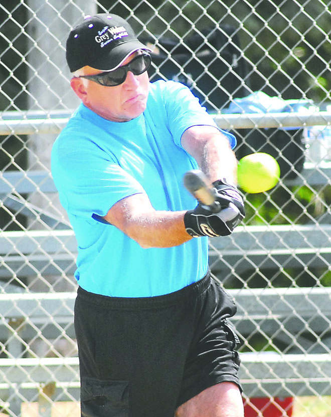 Gary Boor of Sequim bats for his Danger Zone team of Sequim and Port Angeles players against a team from Kent during Saturday's Senior Games softball matchups at Shane Park in Port Angeles. Slow-pitch softball games continue today at 9 a.m. Keith Thorpe/Peninsula Daily News