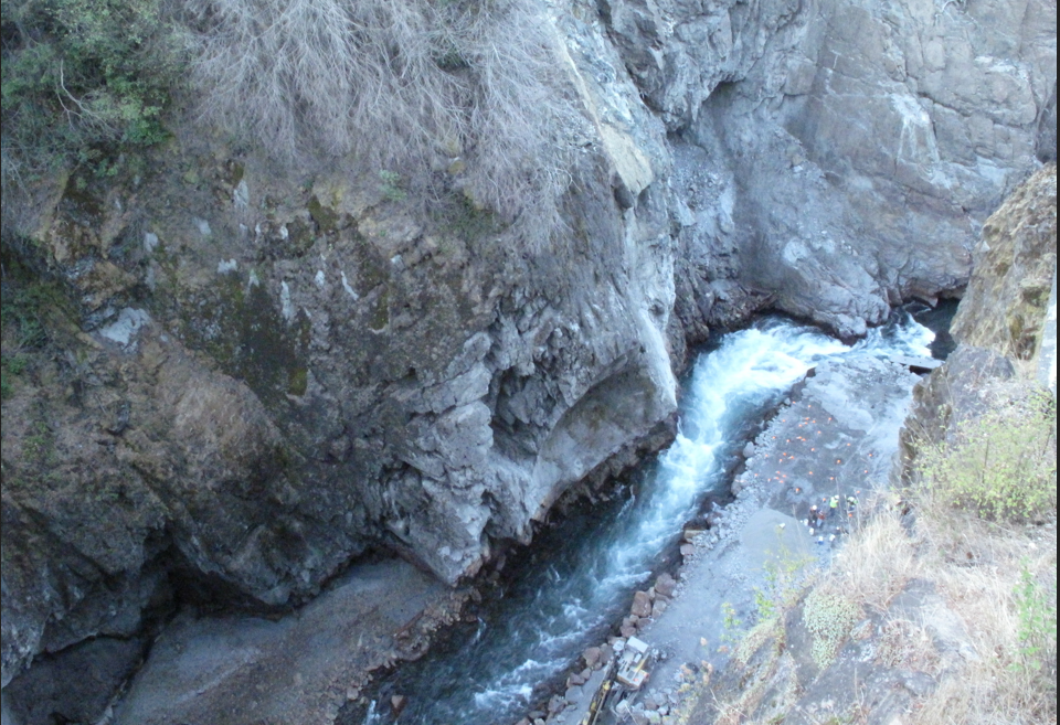 The concrete stub of Glines Canyon Dam next to the Elwha River