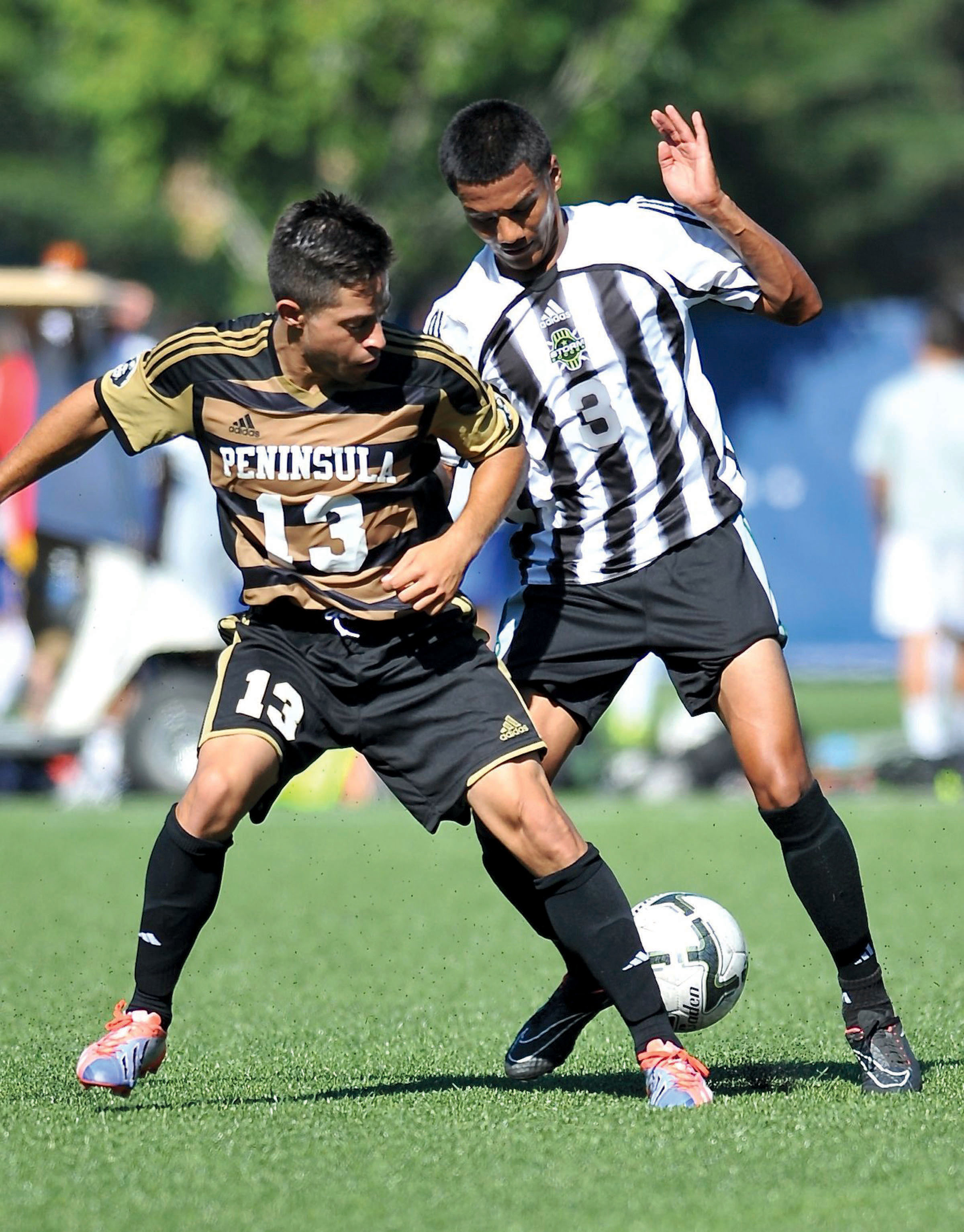 Peninsula's Steven Rodriguez (13) challenges Chemeketa's Elvis Pavon for the ball during the NWAC Friendlies at Starfire Sports Complex in Tukwila. Rodriguez had a goal and an assist for the Pirates in their 5-1 win. Jeff Halstead/for Peninsula Daily News