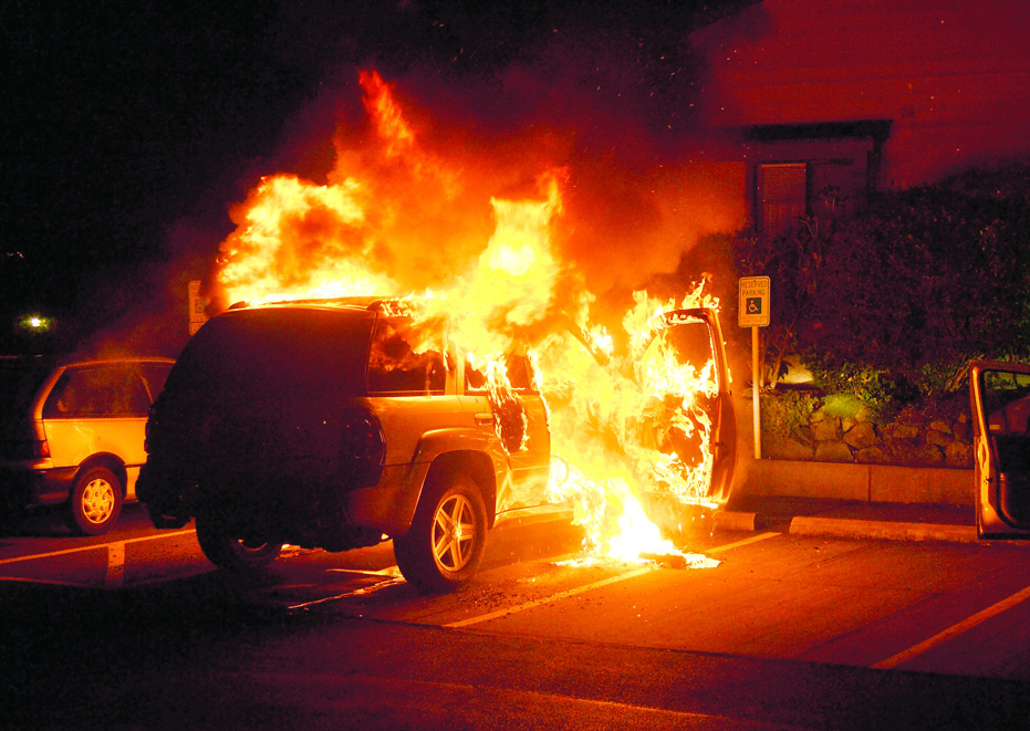 A late-model Chevrolet Trailblazer is fully engulfed in flames early Sunday in the 800 block of Hancock Street. Bill Beezley/East Jefferson Fire-Rescue