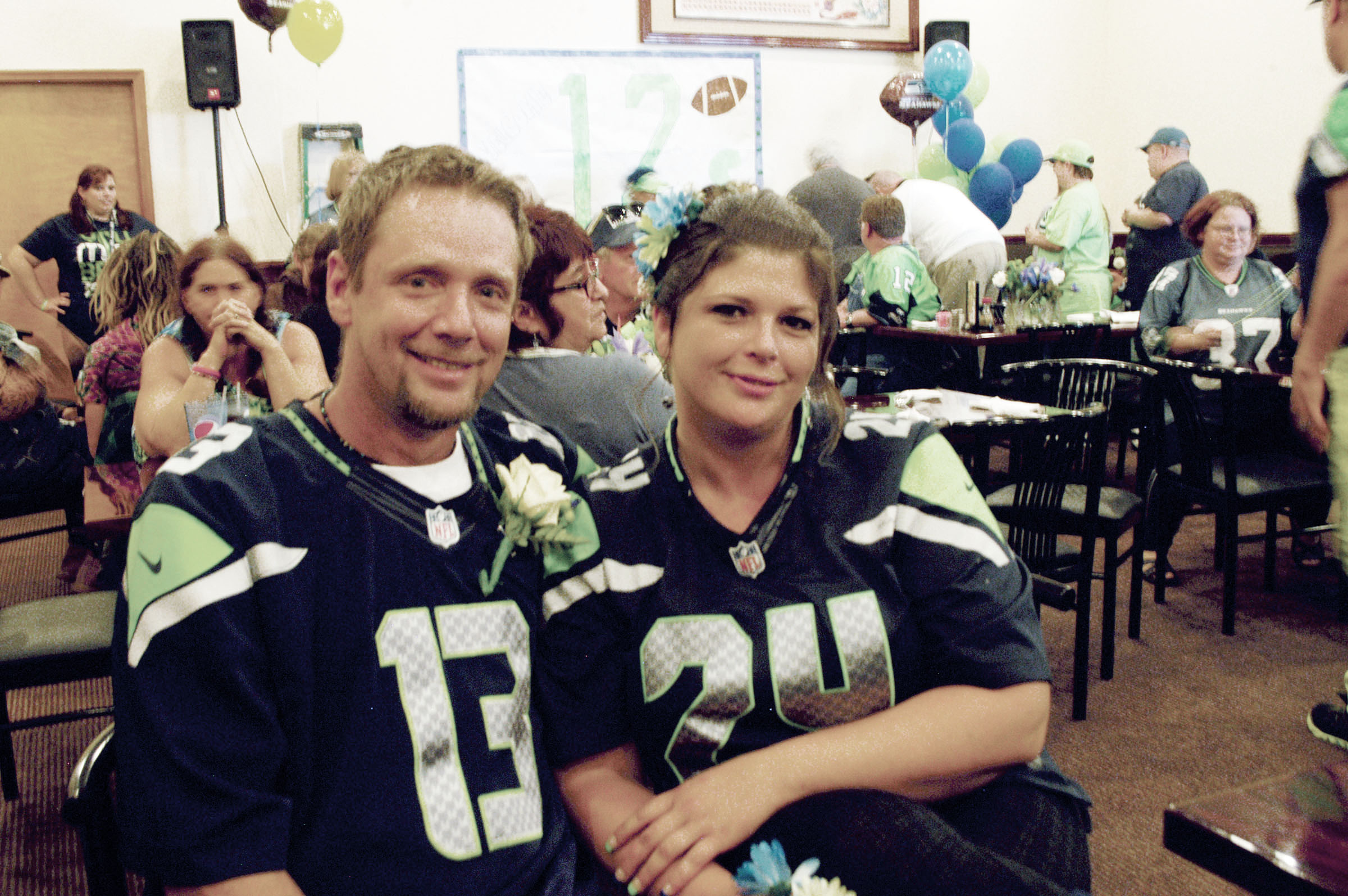 Rob Heagy and Jeanene George held their wedding Saturday at the Seahawks rally at Asian Buffet restaurant in Port Angeles. — Paul Gottlieb/Peninsula Daily News Paul Gottlieb/Peninsula Daily News