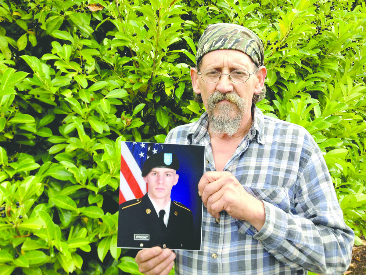 David Sands of Sequim holds a photo of his soon-to-be stepson